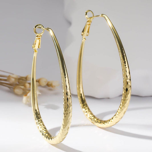 Golden Glossy Spring Fastener Egg-shaped Earrings Hypoallergenic Copper - P12 Hub Europe